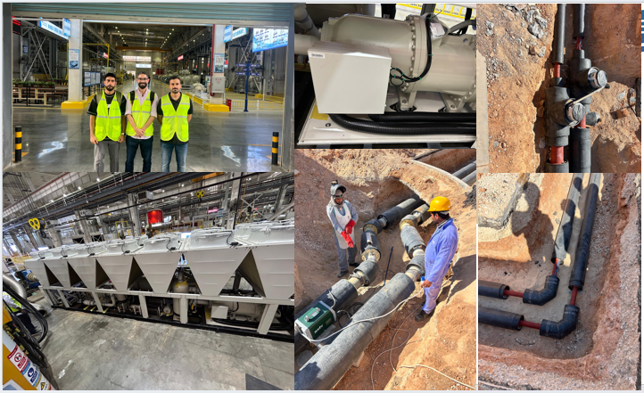 A modern commercial building with complex HVAC systems on the roof.